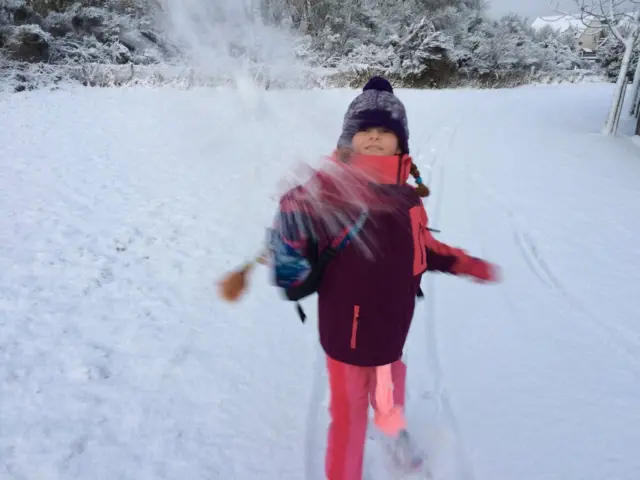 Girl throwing snowball