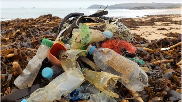 Broken plastic bottles washed up on the beach