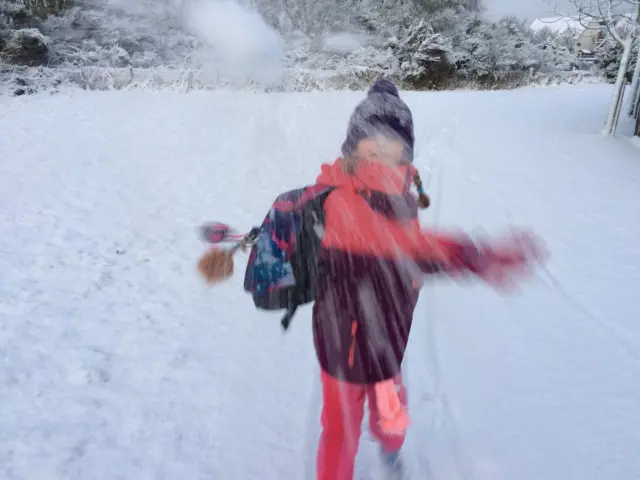 Girl throwing snowball