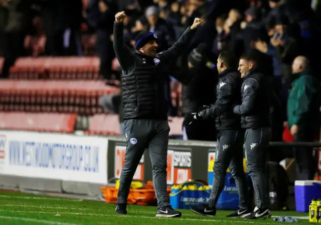 Wigan manager Paul Cook celebrates