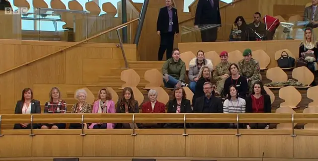 Members of the armed forces in the gallery