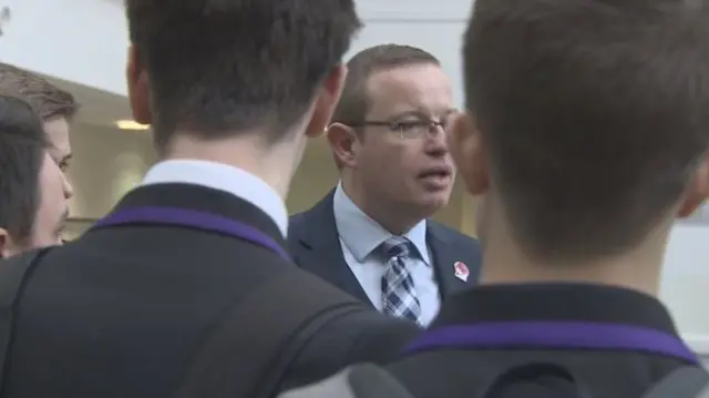 Scott Pennock, the head teacher at Wallace High School in Stirling talks to pupils