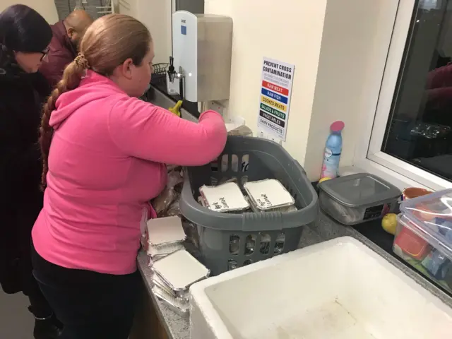 Volunteer sorts food