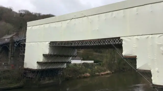 The Iron Bridge covered in scaffolding and plastic sheeting