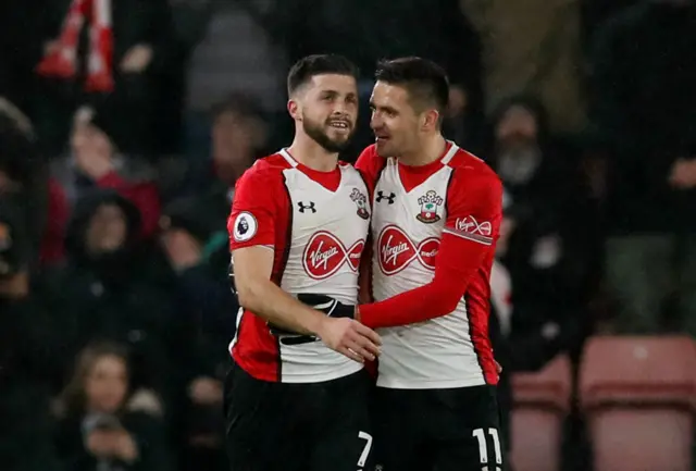 Southamptons Shane Long celebrates scoring their first goal with Dusan Tadic