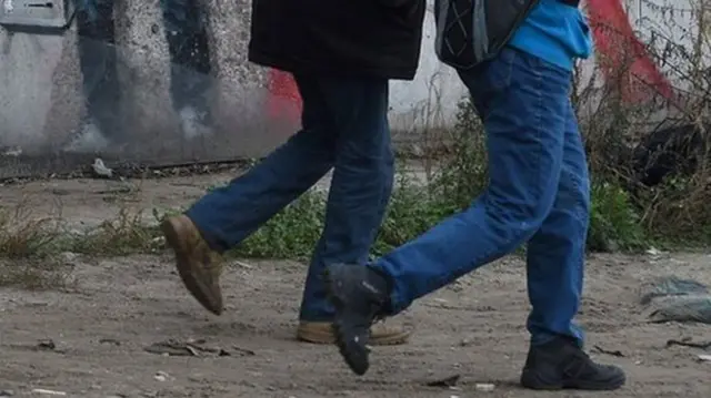 Two children walking