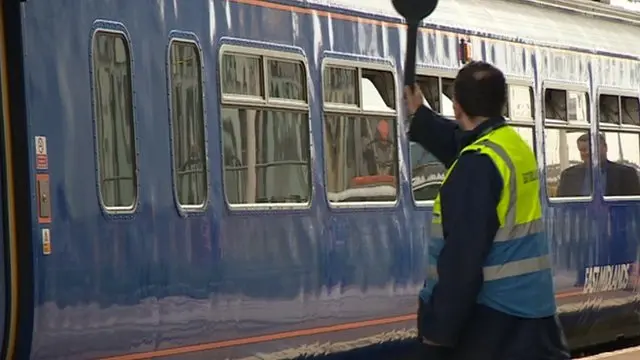 Guard and an East Midlands Train