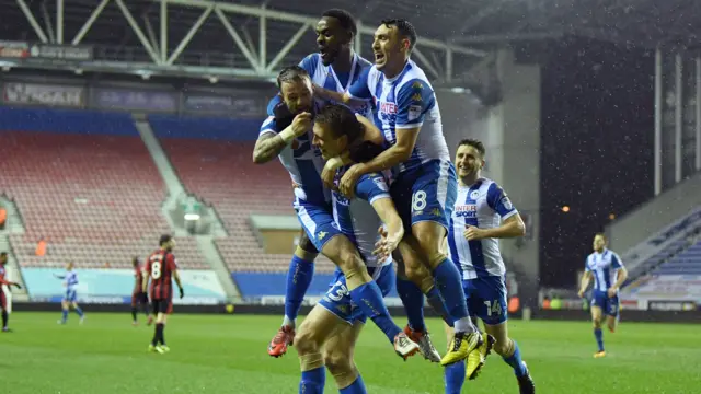 Wigan's Dan Burn celebrates scoring his side's second goal against Bournemouth in the FA Cup