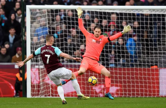 Asmir Begovic in action with West Ham United's Marko Arnautovic