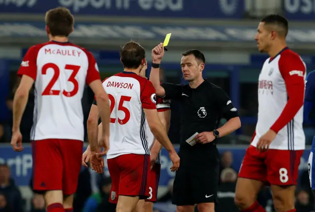 Craig Dawson is shown a yellow card