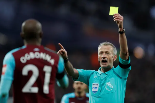 Angelo Ogbonna is shown a yellow card