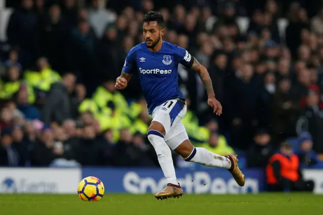 Theo Walcott runs with possession of the ball