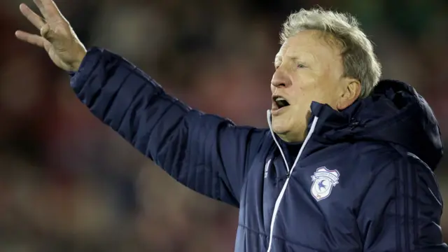 Neil Warnock gestures to his side during Cardiff's game at Barnsley in November