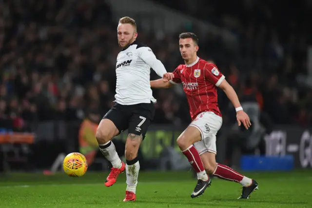 Derby's Johnny Russell and Bristol City's Joe Bryan battle for the ball