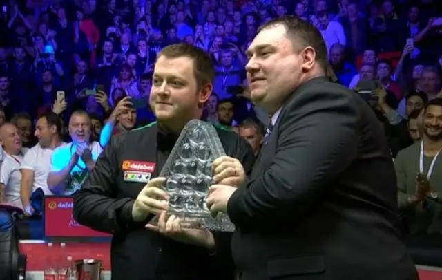 Mark Allen celebrates with the trophy