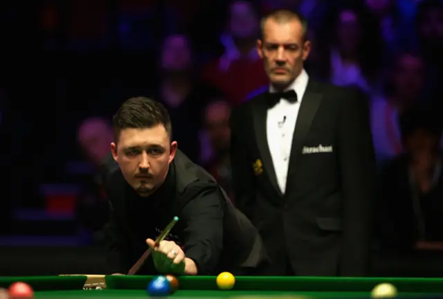 Kyren Wilson plays a shot