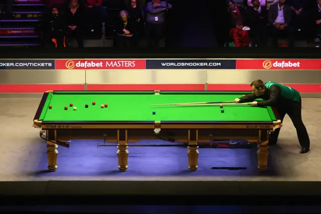 Mark Allen plays a shot