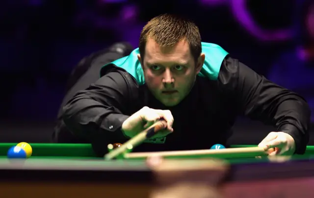 Mark Allen plays a shot