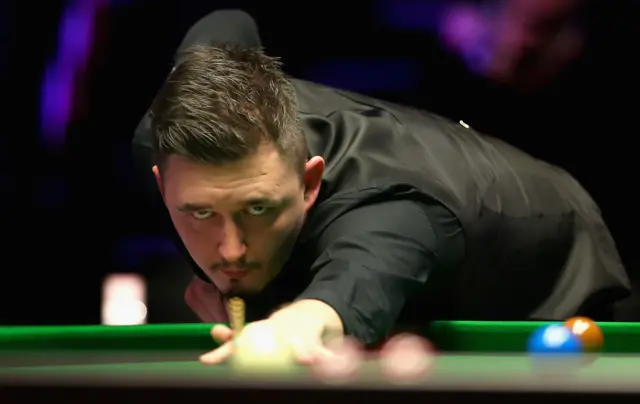 Kyren Wilson plays a shot