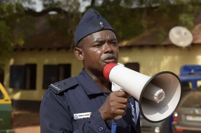 Ghanaian police officer Emile Gyebi addresses police and paramilitary officers waiting to be deployed at the metropolitan police headquarters in Tamale on December 6, 2016 on the eve of the presidential and parliamentary elections.