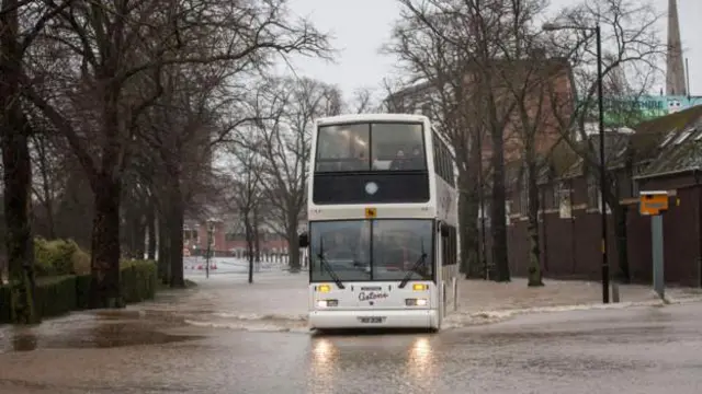 A bus battles flood water on New Road, Worcester, in 2014