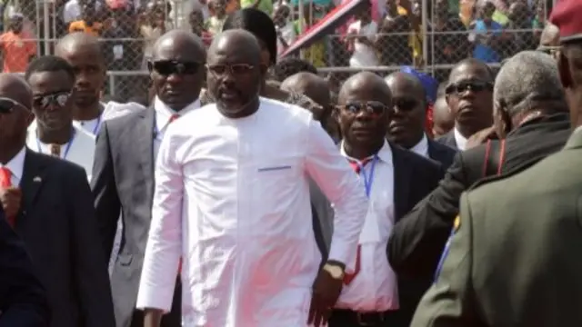 Liberia"s President George Weah arrives for his swearing-in ceremony at the Samuel Kanyon Doe Sports Complex in Monrovia, Liberia, January 22, 2018