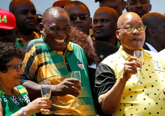 African National Congress (ANC) President Cyril Ramaphosa (L) reatcs as he celebrates the Congress" 106th anniversary celebrations with President of South Africa Jacob Zuma, in East London, South Africa, January 13, 2018.