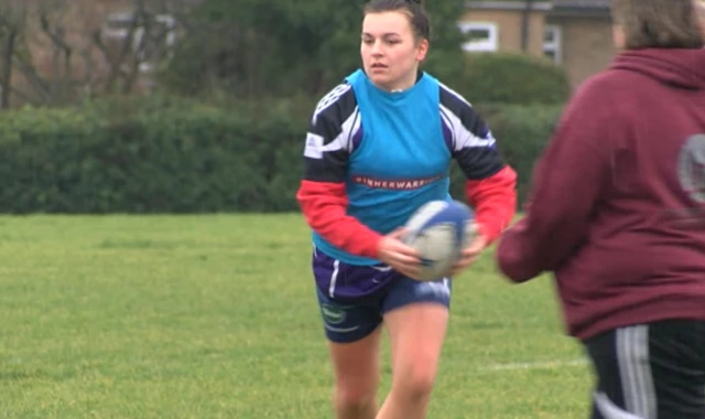 women playing rugby