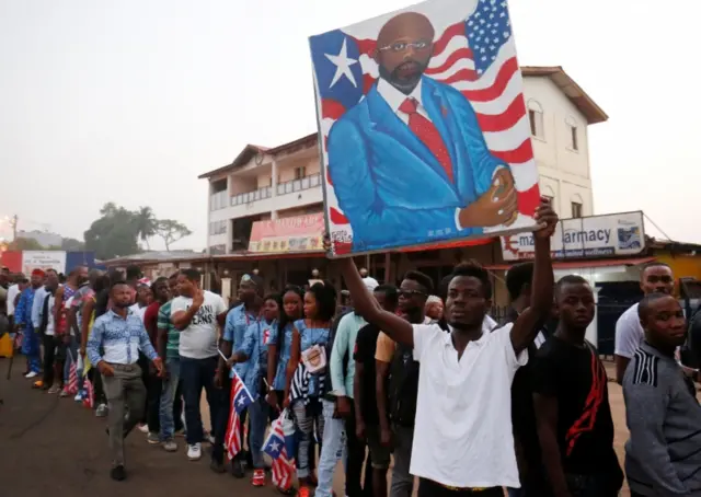 Supporters of Liberia's President George Weah arrive for his swearing-in ceremony at Samuel Kanyon Doe Sports Complex in Monrovia, Liberia, January 22, 2018