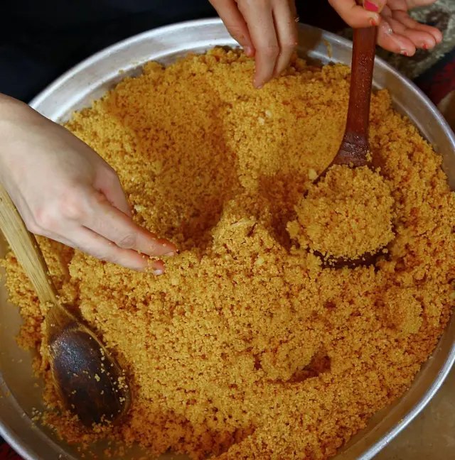 Libyan women prepare couscous in the capital Tripoli on October 26, 2014.