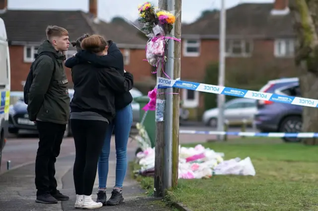 Friends read floral tributes to Mylee