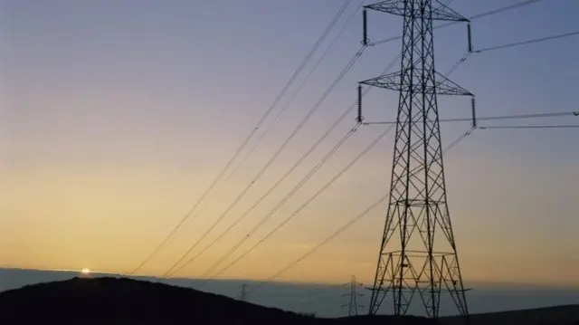 Pylon in front of sunset