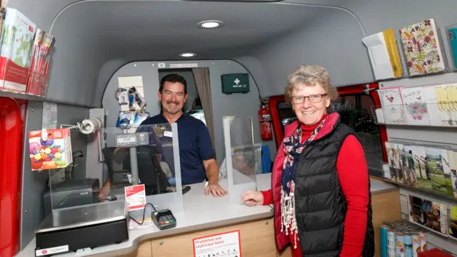 Woman visits a mobile post office