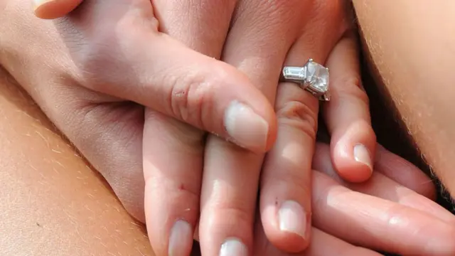 Engagement ring on a finger