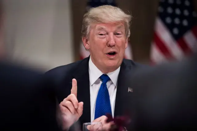 US President Donald Trump gestures as he speaks during a working dinner with European business leaders during the World Economic Forum (WEF) annual meeting in Davos, eastern Switzerland, on January 25, 2018.