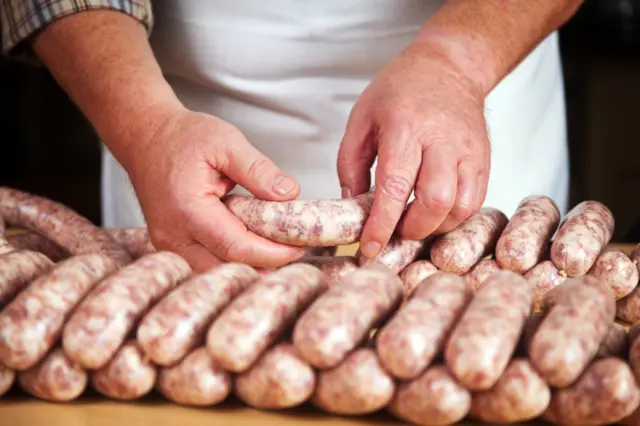 A man making sausages