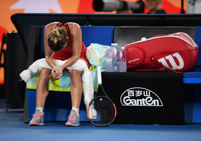 Simona Halep of Romania looks dejected