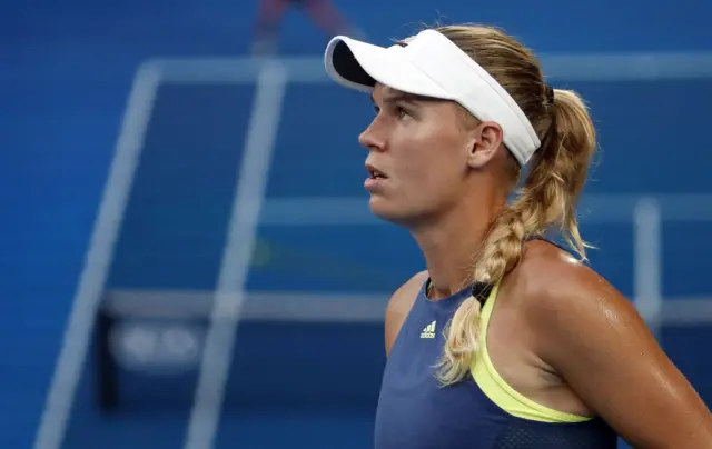 Caroline Wozniacki watches a challenge