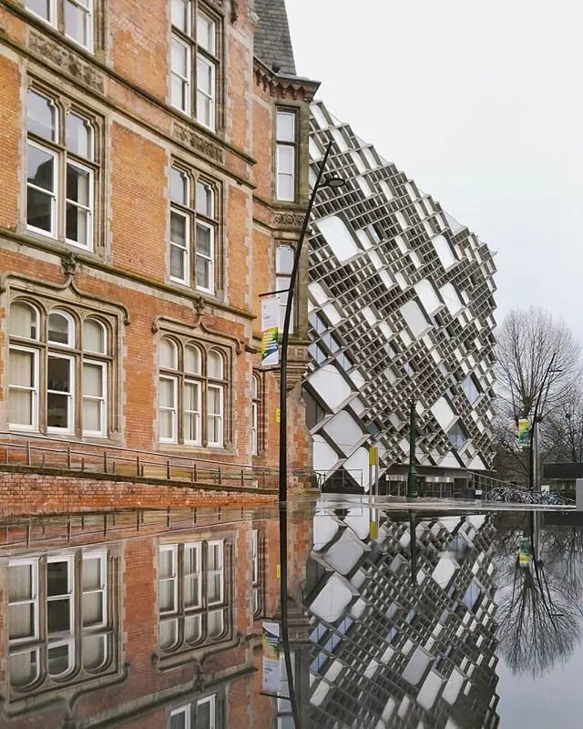 Jessop Building and The Diamond and reflections in pavement water