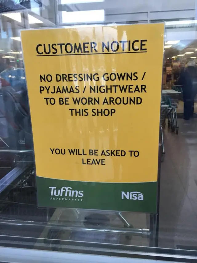 Sign in Tuffins reading: "No dressing gowns/ pyjamas/ nightwear to be worn around this shop.  You will be asked to leave.