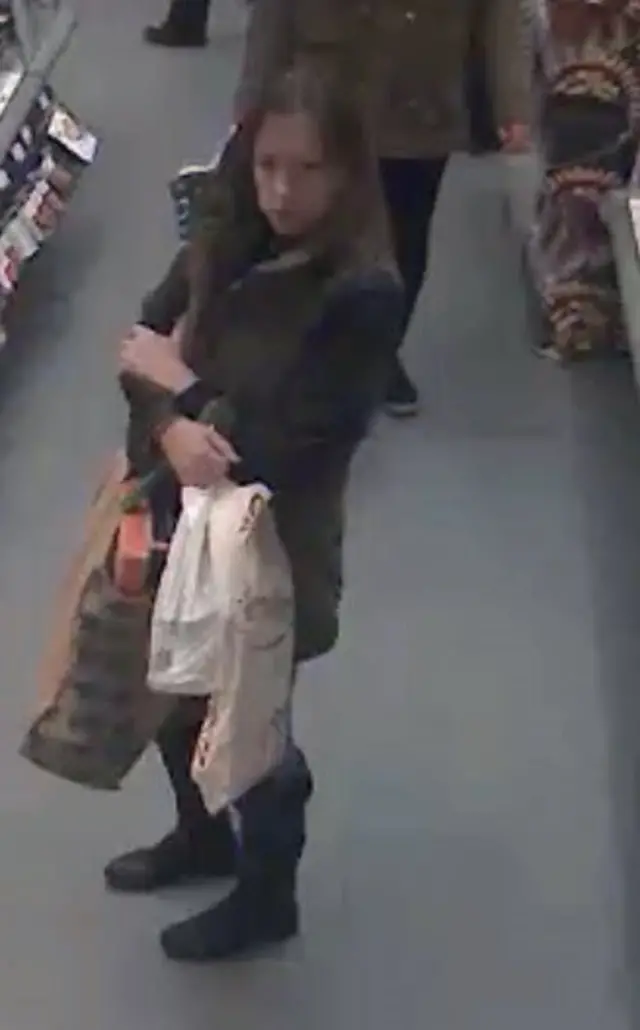 CCTV image of woman