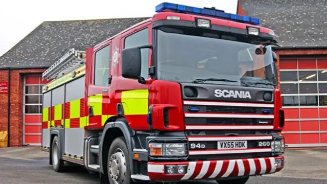 A fire engine with Hereford and Worcester Fire Service