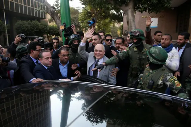 Moussa Mostafa Moussa (C) leaves after submitting his presidential candidacy papers in front of the National Election Authority, in Cairo, Egypt, 29 January 2018.