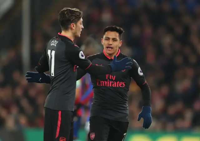 Alexis Sanchez and Mesut Ozil in action for Arsenal