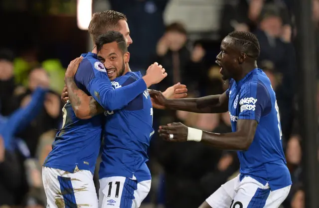 Walcott celebrates with his teammates