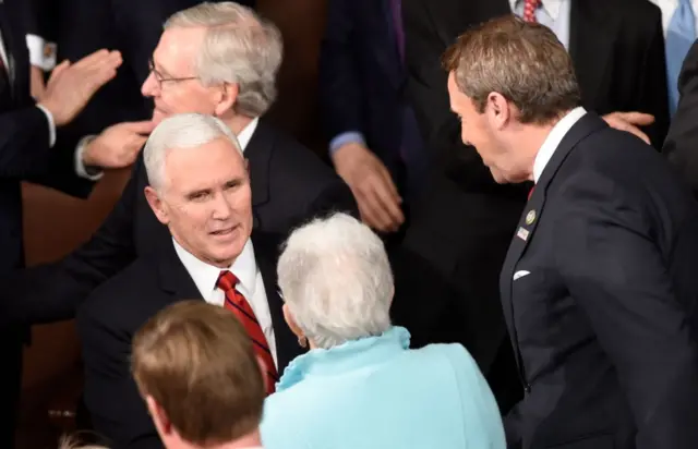 Pence enters the chamber