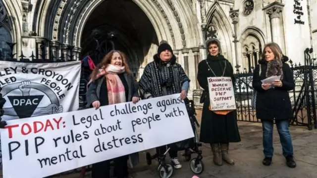 Campaigners protesting Personal Independence Payments outside courts in London