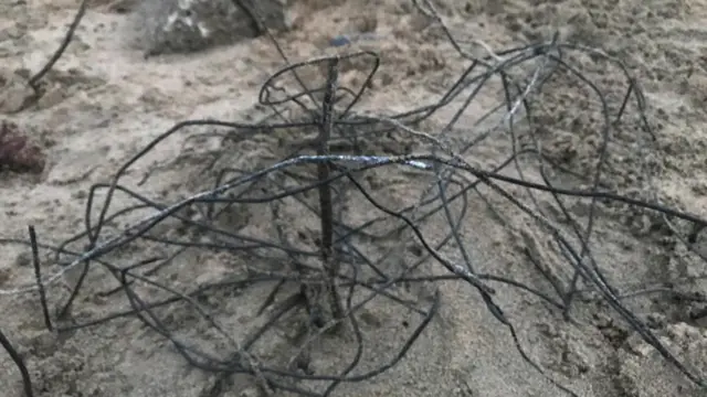 waste metal in sand