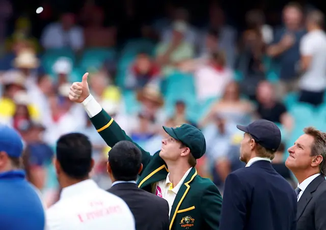 Steve Smith tosses the coin