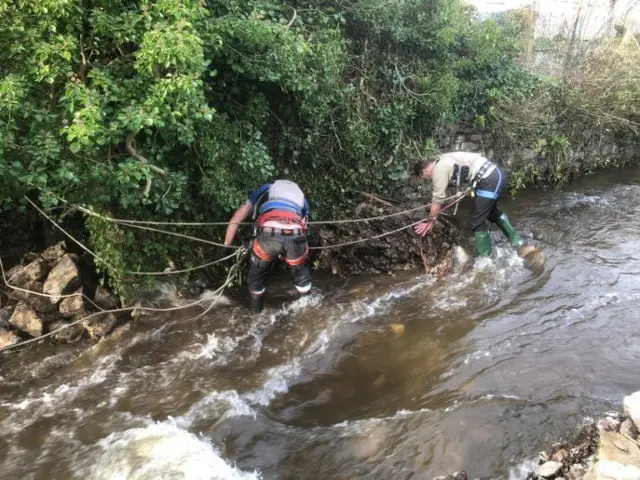 River and collapsed river wall